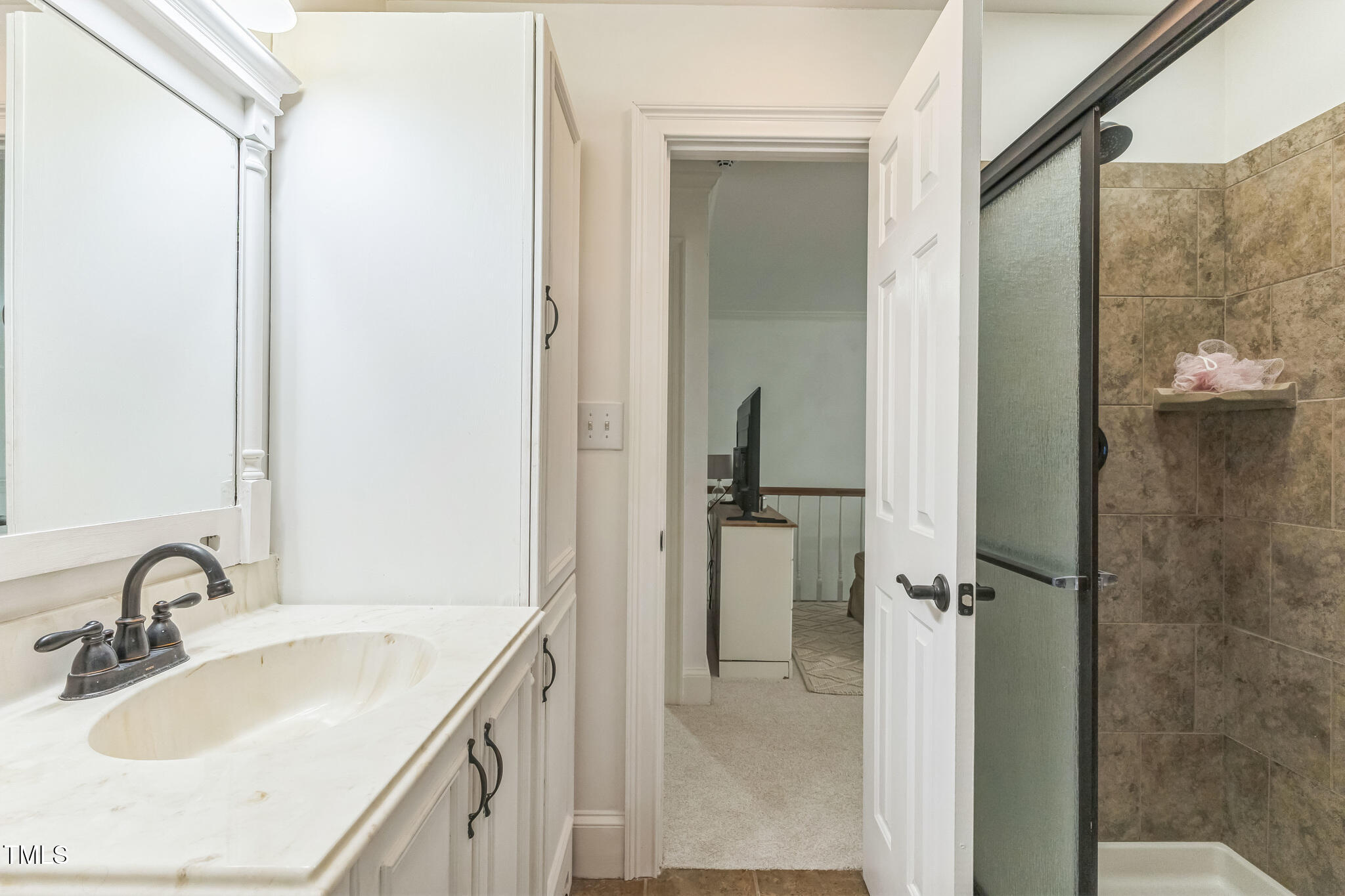 1708 Pendelton Drive Raleigh, NC 27614 - Photo 34 of 54 a bathroom with a sink and a mirror