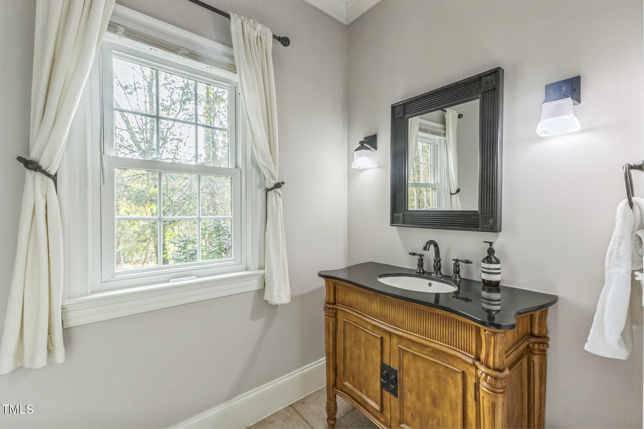 1708 Pendelton Drive Raleigh, NC 27614 - Photo 39 of 54 a bathroom with a sink vanity granite and a mirror