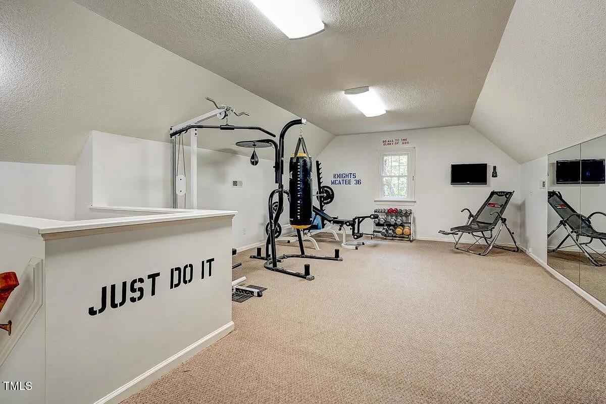 1708 Pendelton Drive Raleigh, NC 27614 - Photo 40 of 54 a view of a room with gym equipment
