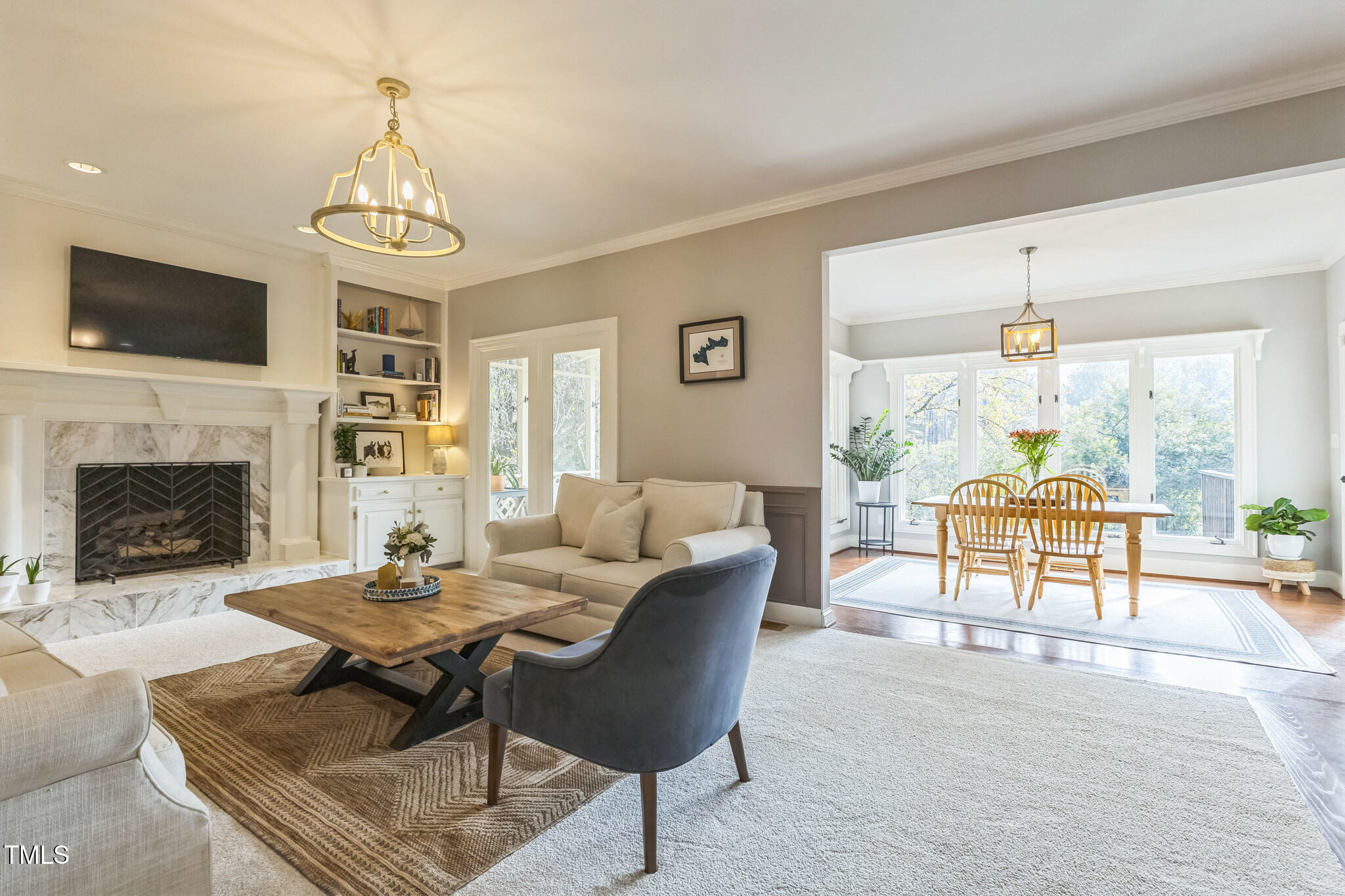 1708 Pendelton Drive Raleigh, NC 27614 - Photo 6 of 54 a living room with furniture a flat screen tv and a fireplace