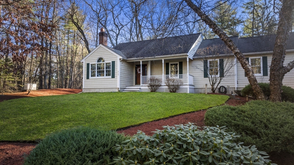 512 A Main Street Boxford, MA 01921 - Photo 1 of 41 a front view of a house with a yard and trees