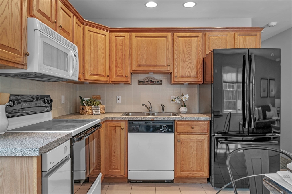 512 A Main Street Boxford, MA 01921 - Photo 23 of 41 a kitchen with a sink stove and refrigerator