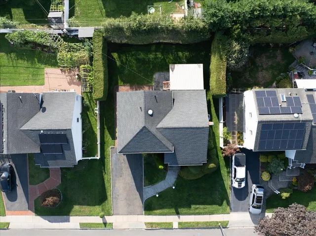 an aerial view of a house with garden space