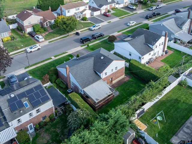 an aerial view of a house with a garden