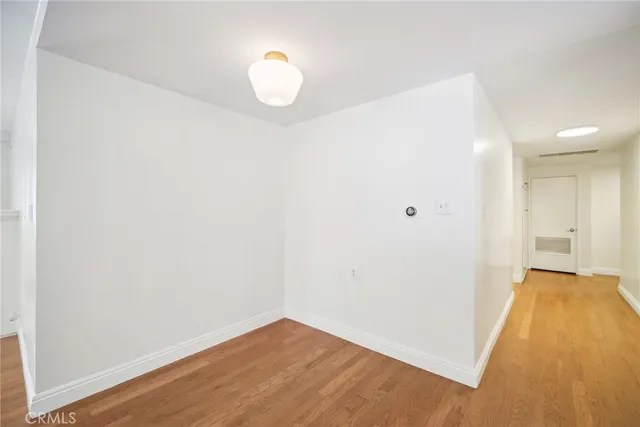 a view of a kitchen with wooden floor