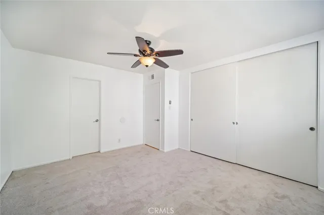 a view of a big room with carpet