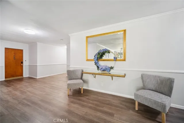 a view of a livingroom with furniture and a window