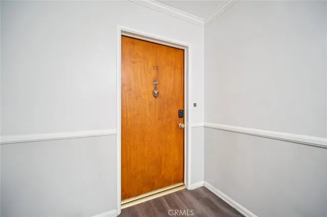 a view of a small space with wooden floor