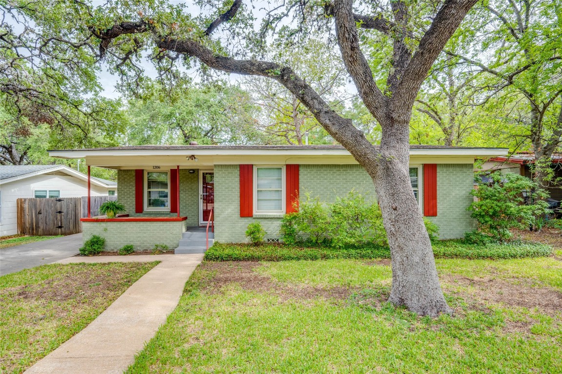 1206 Fieldcrest Drive Austin, TX 78704 - Photo 1 of 1 front view of a house with a yard