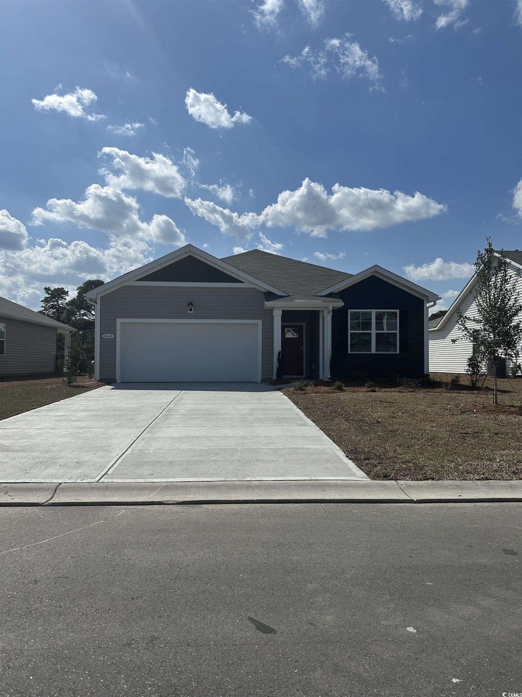 4048 Elmridge Court Conway, SC 29526 - Photo 1 of 22 View of front of house with driveway, an attached garage, and a front yard