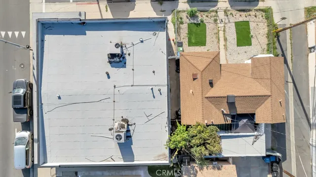 an aerial view of a house with a yard