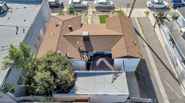 an aerial view of residential houses with city view