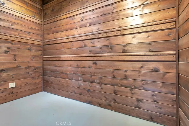 a view of a room with wooden walls
