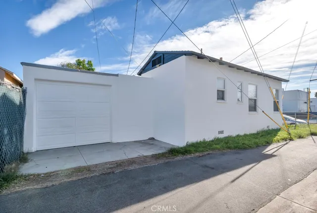 an aerial view of a house with garden space and street view