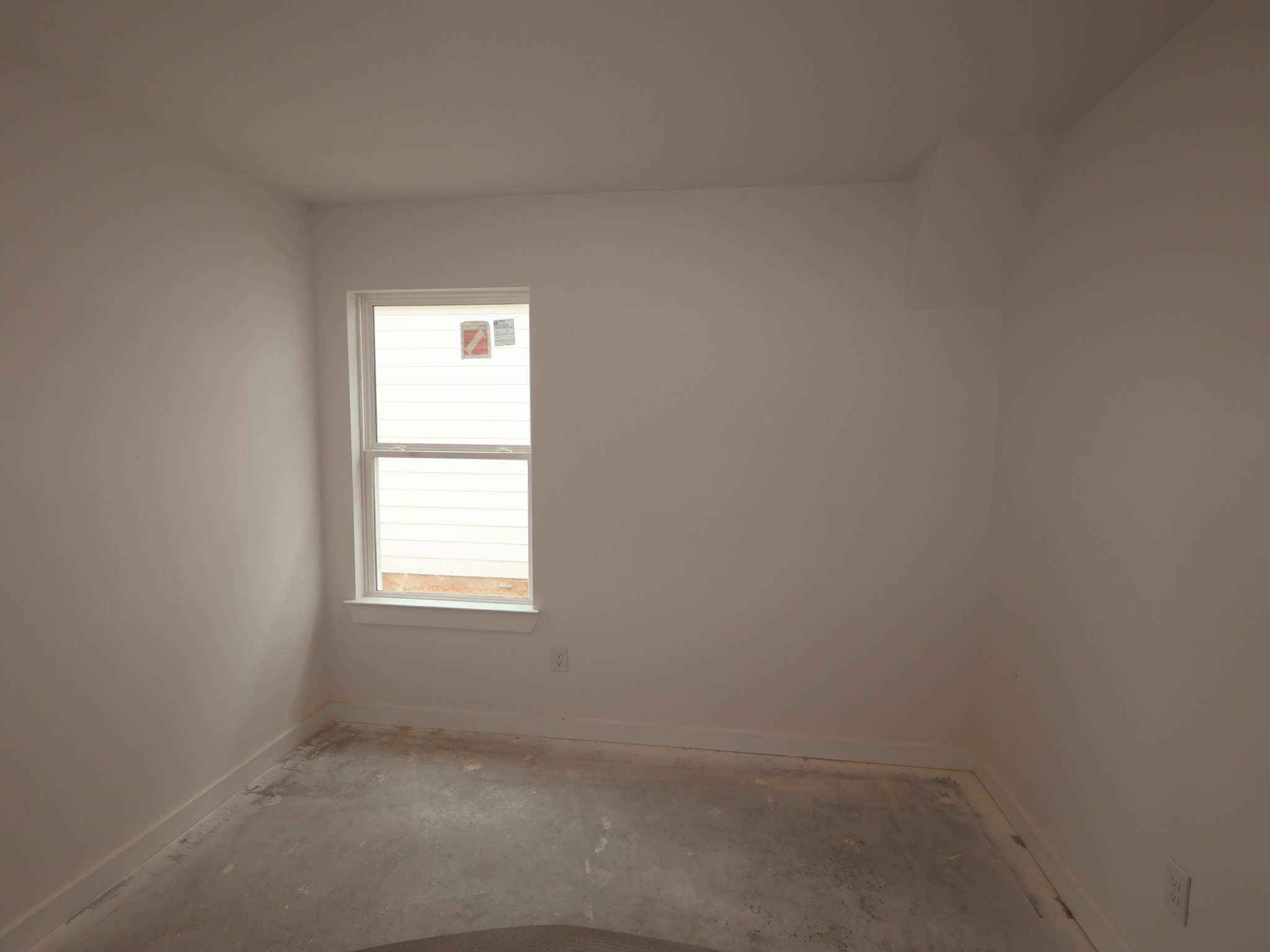32519 Midsummer Drive Fulshear, TX 77441 - Photo 11 of 15 an empty room with a window