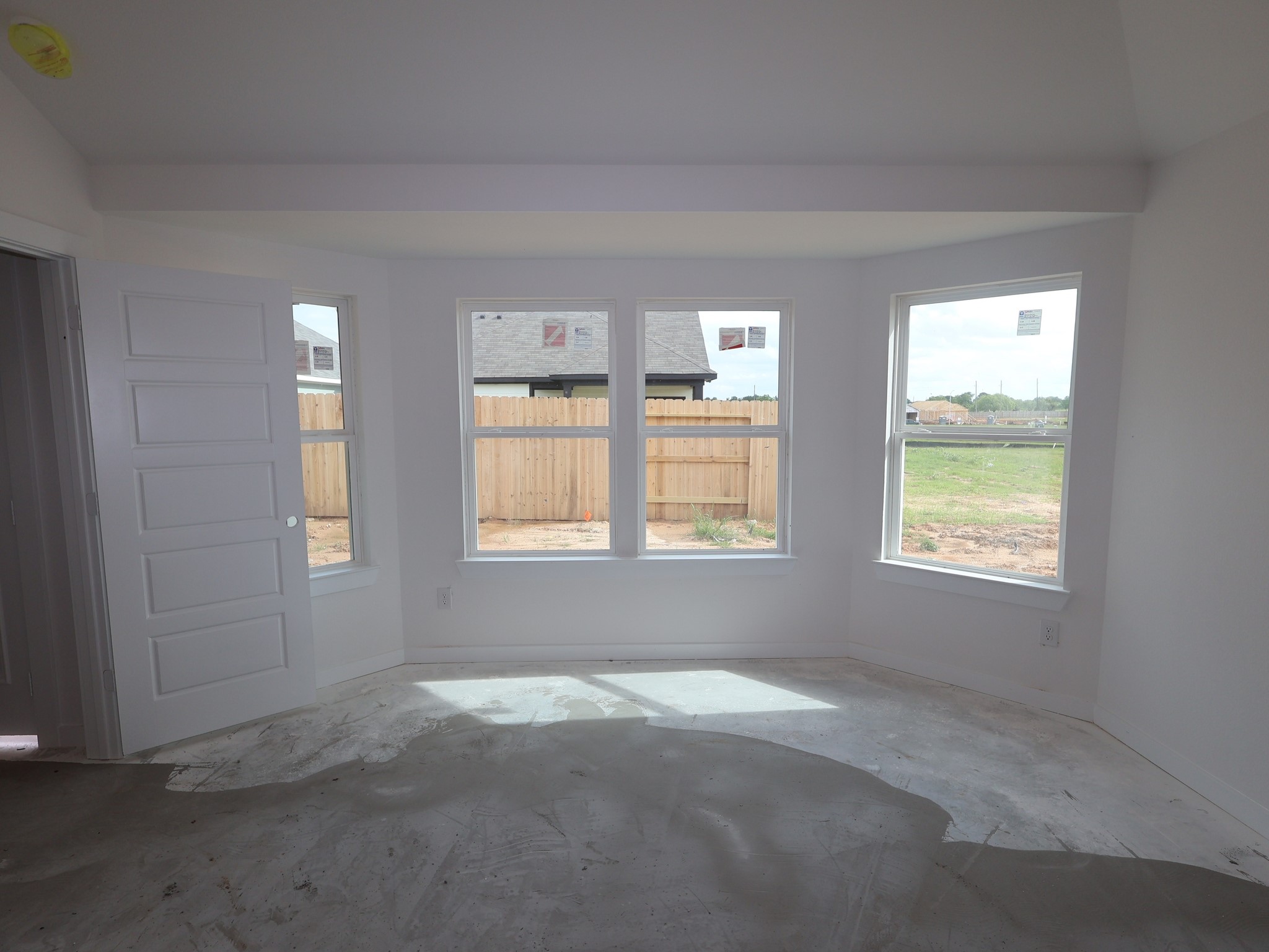 32519 Midsummer Drive Fulshear, TX 77441 - Photo 6 of 15 a view of an empty room with a window