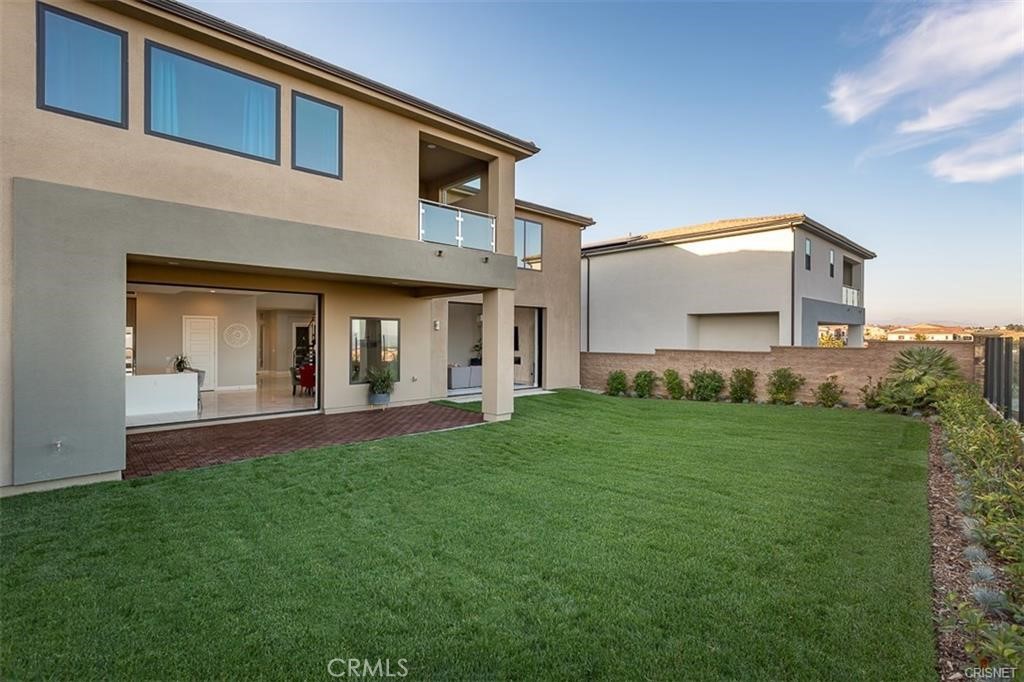 11527 North Darcy Porter Ranch Porter Ranch, CA 91326 - Photo 3 of 32 a front view of a house with a yard and garage