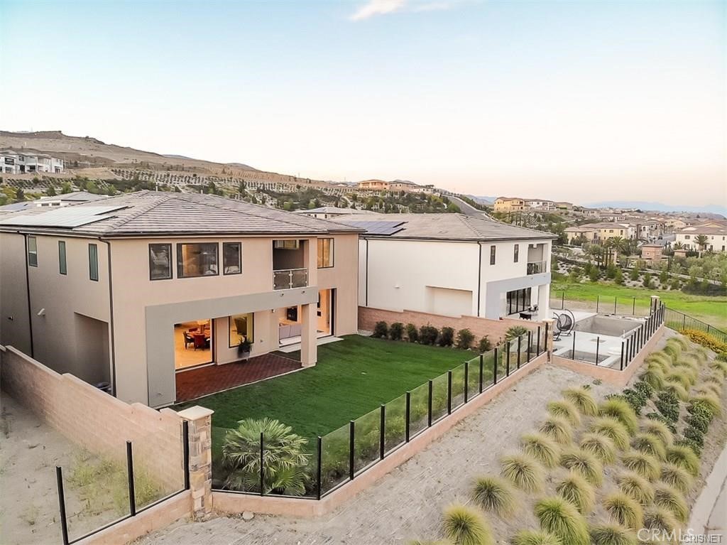 11527 North Darcy Porter Ranch Porter Ranch, CA 91326 - Photo 4 of 32 a view of a house with wooden deck and furniture