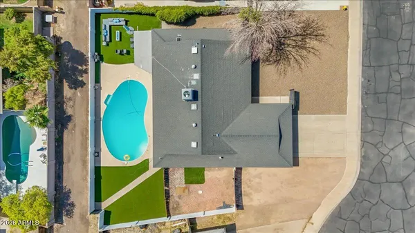 an aerial view of a house with swimming pool