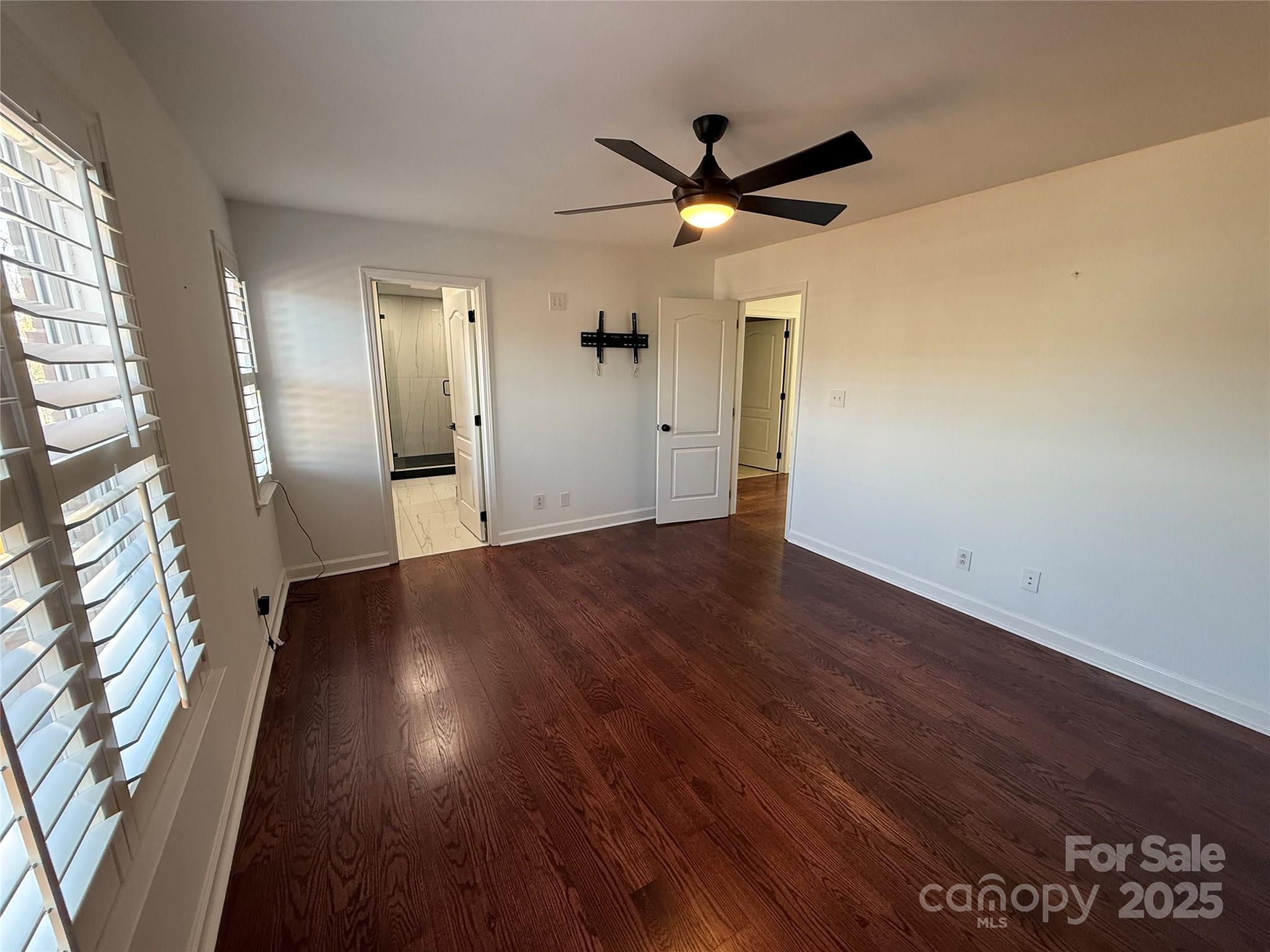 18731 Ramsey Cove Drive, Unit 72 Cornelius, NC 28031 - Photo 15 of 33 wooden floor in an empty room with a window