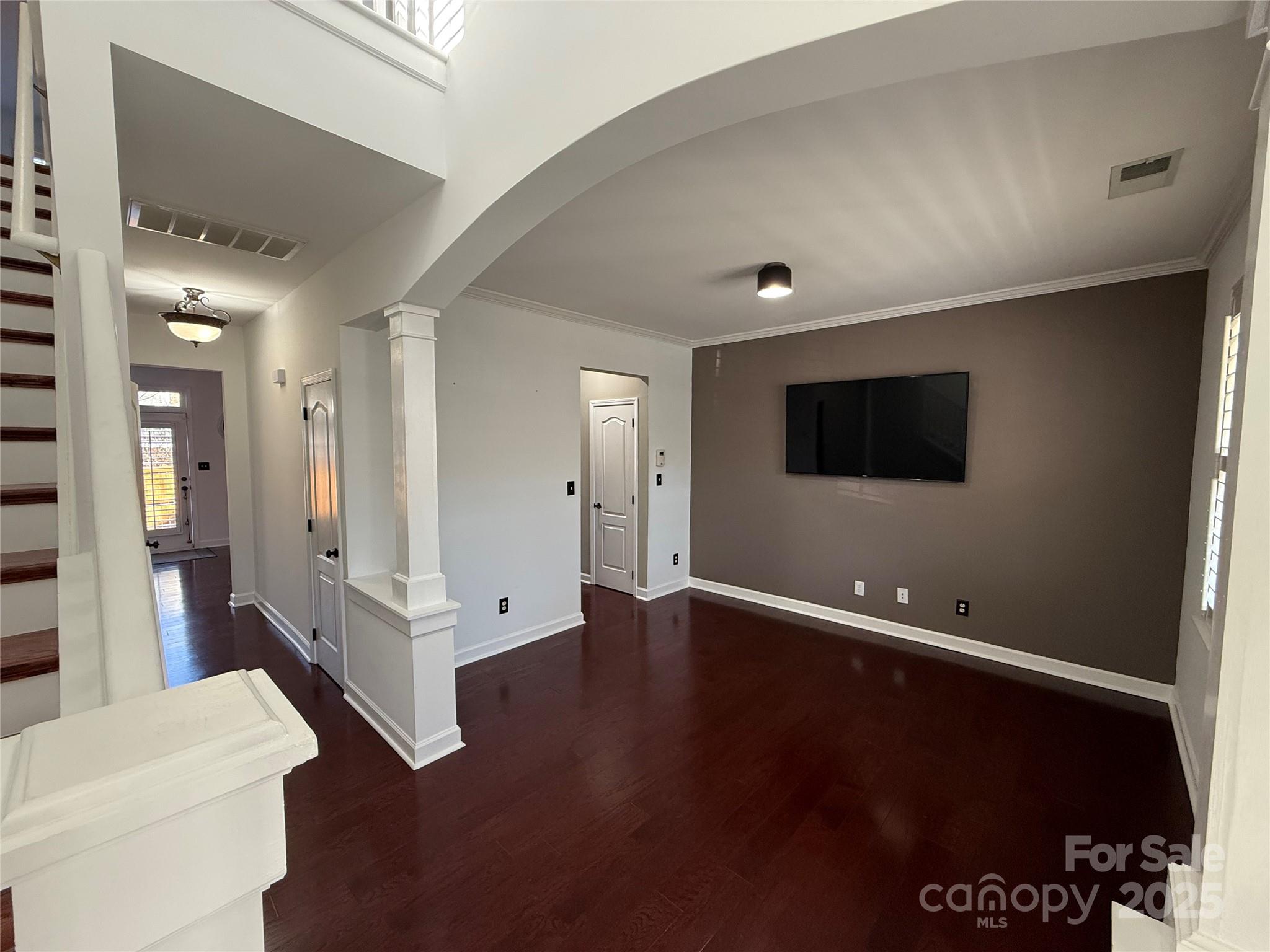 18731 Ramsey Cove Drive, Unit 72 Cornelius, NC 28031 - Photo 2 of 33 a living room with hard wood floor and a hallway
