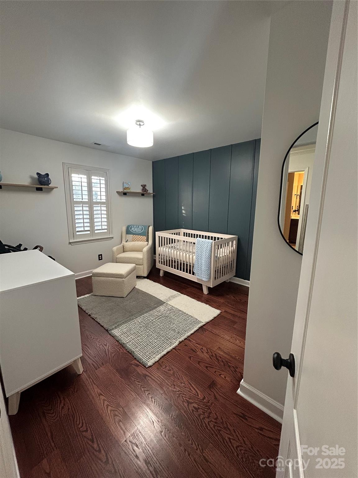 18731 Ramsey Cove Drive, Unit 72 Cornelius, NC 28031 - Photo 29 of 33 a living room with furniture and a wooden floor