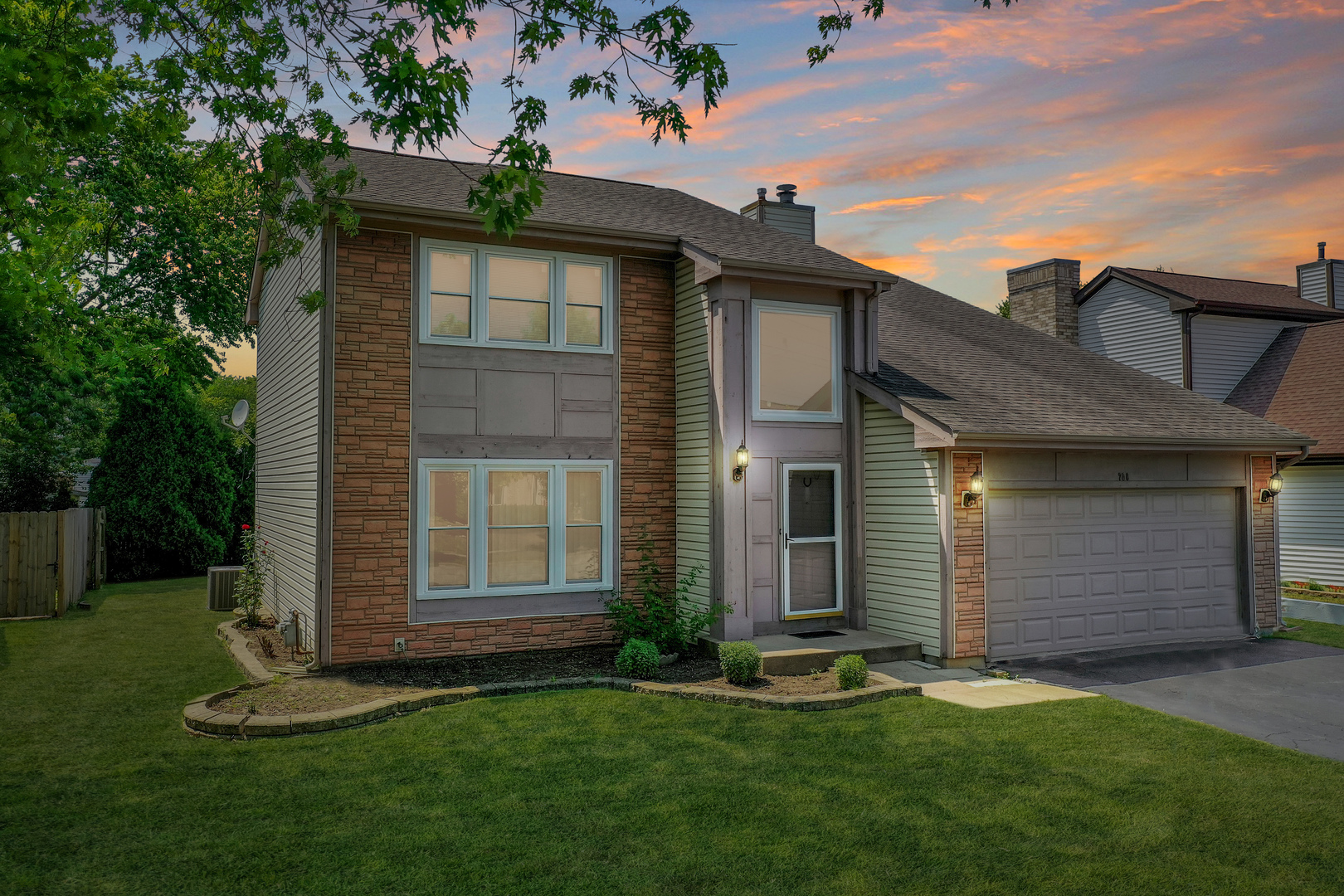 700 Greenview Lane Wheeling, IL 60090 - Photo 1 of 26 front view of a house with a yard