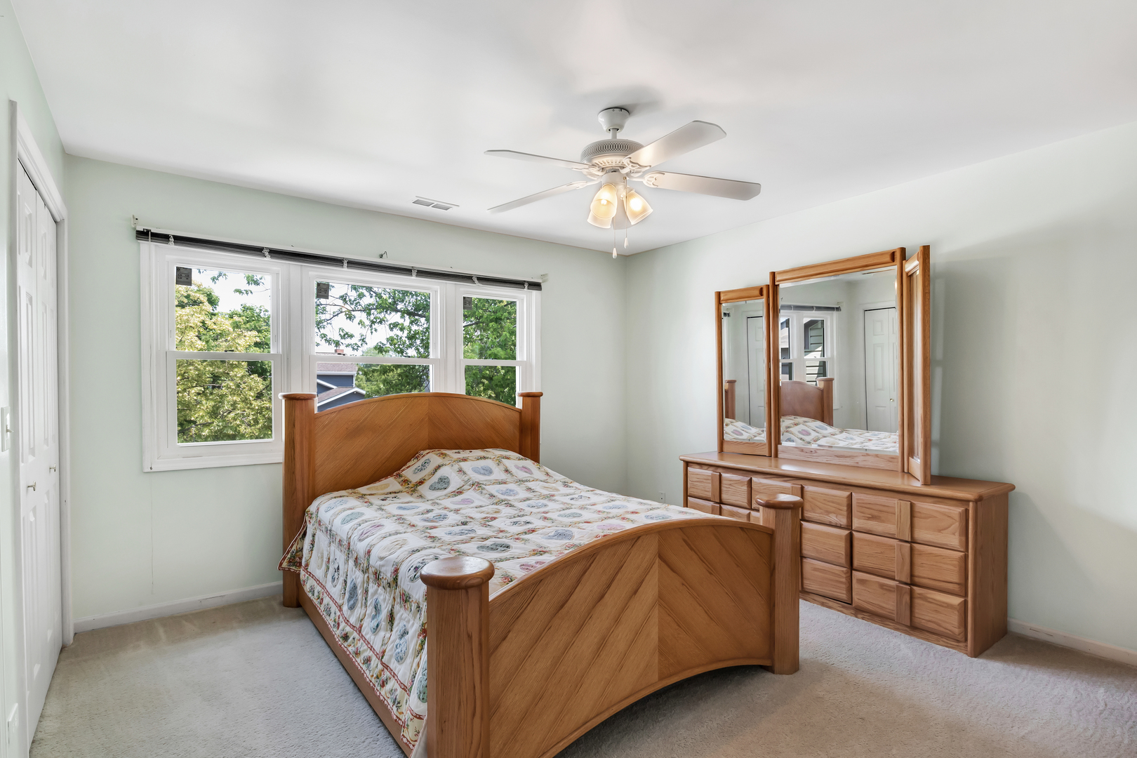 700 Greenview Lane Wheeling, IL 60090 - Photo 12 of 26 a bedroom with a large bed and a window