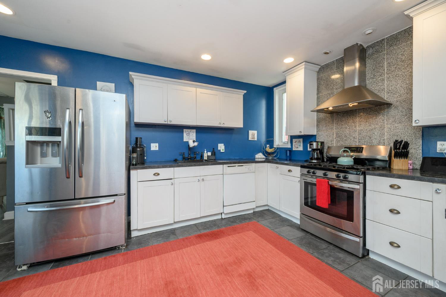 39 East 2nd Avenue Runnemede, NJ 08078 - Photo 12 of 41 a kitchen with stainless steel appliances granite countertop a refrigerator sink and stove