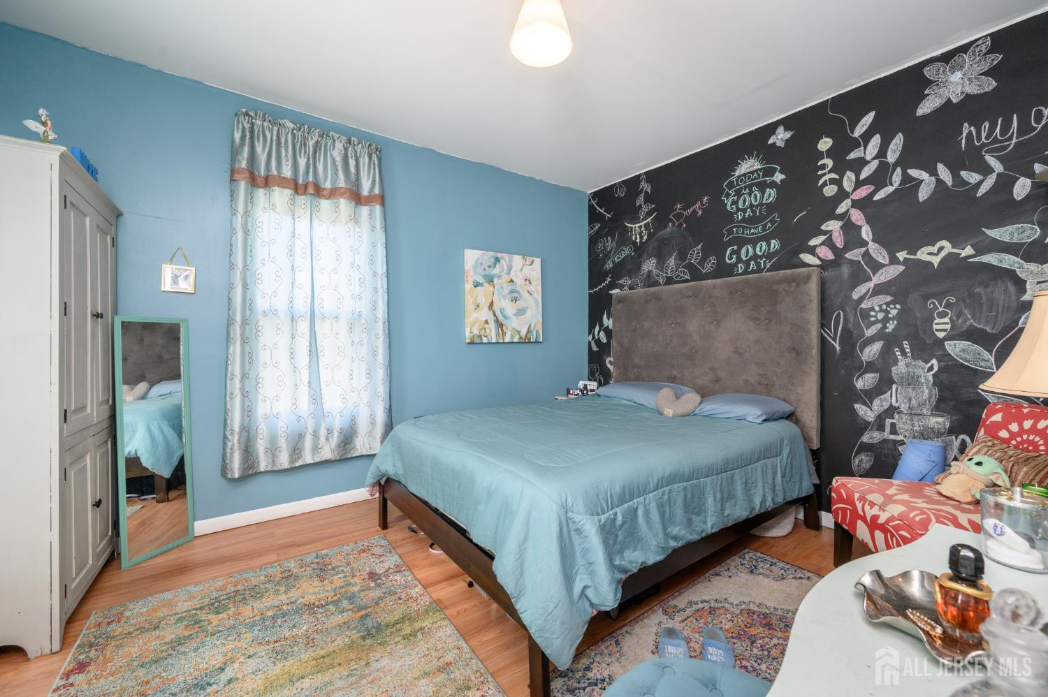 39 East 2nd Avenue Runnemede, NJ 08078 - Photo 15 of 41 a bedroom with a bed and a window