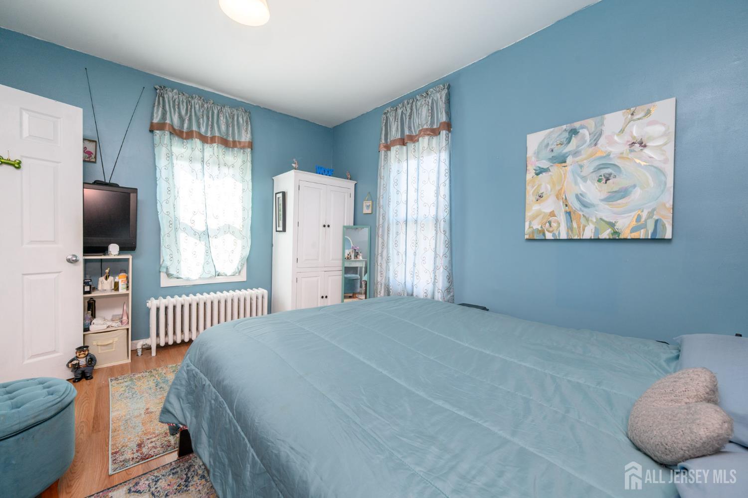 39 East 2nd Avenue Runnemede, NJ 08078 - Photo 16 of 41 a bedroom with a bed and a flat screen tv