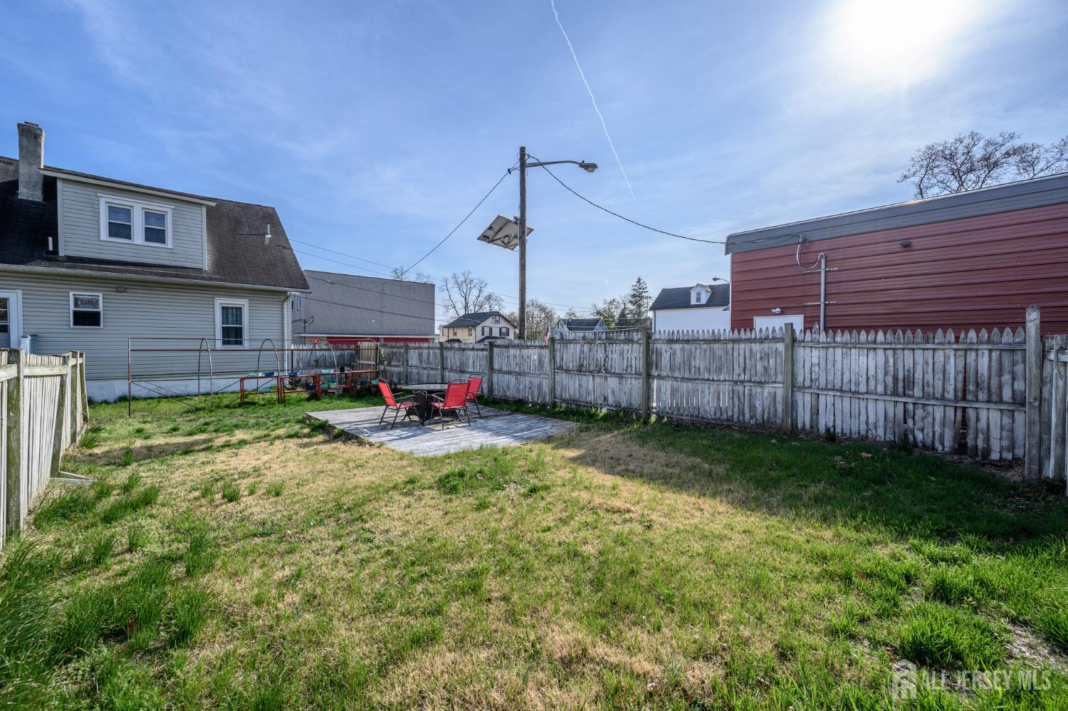 39 East 2nd Avenue Runnemede, NJ 08078 - Photo 32 of 41 a view of backyard with table and chairs and wooden fence