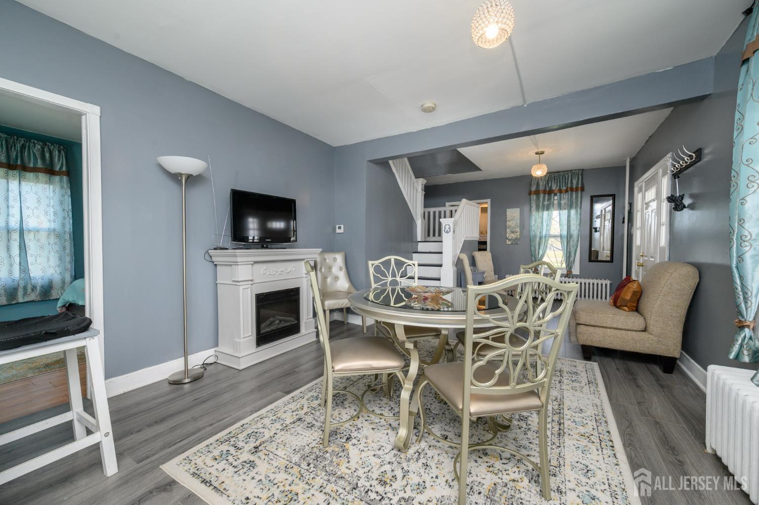 39 East 2nd Avenue Runnemede, NJ 08078 - Photo 8 of 41 a dining room with furniture and a fireplace