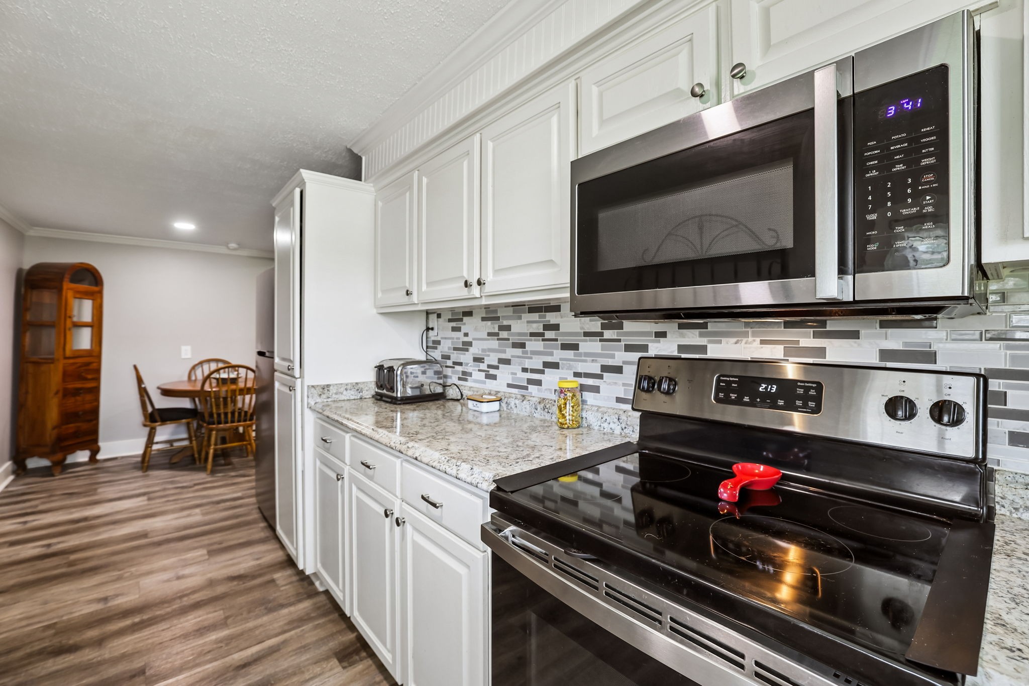 1466 Bible Crossing Road Winchester, TN 37398 - Photo 22 of 42 a kitchen with a stove and a microwave