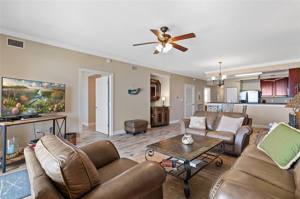 60 Surfview Drive, Unit 502 Palm Coast, FL 32137 - Photo 13 of 63 a living room with furniture and a flat screen tv