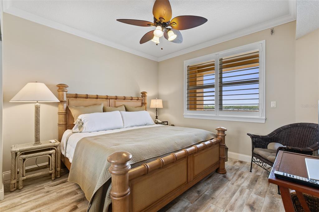 60 Surfview Drive, Unit 502 Palm Coast, FL 32137 - Photo 24 of 63 a bed room with a bed and a chair