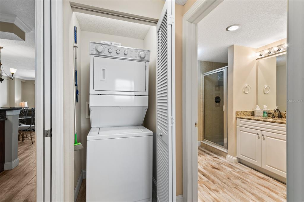 60 Surfview Drive, Unit 502 Palm Coast, FL 32137 - Photo 29 of 63 a view of a hallway with a washer and dryer