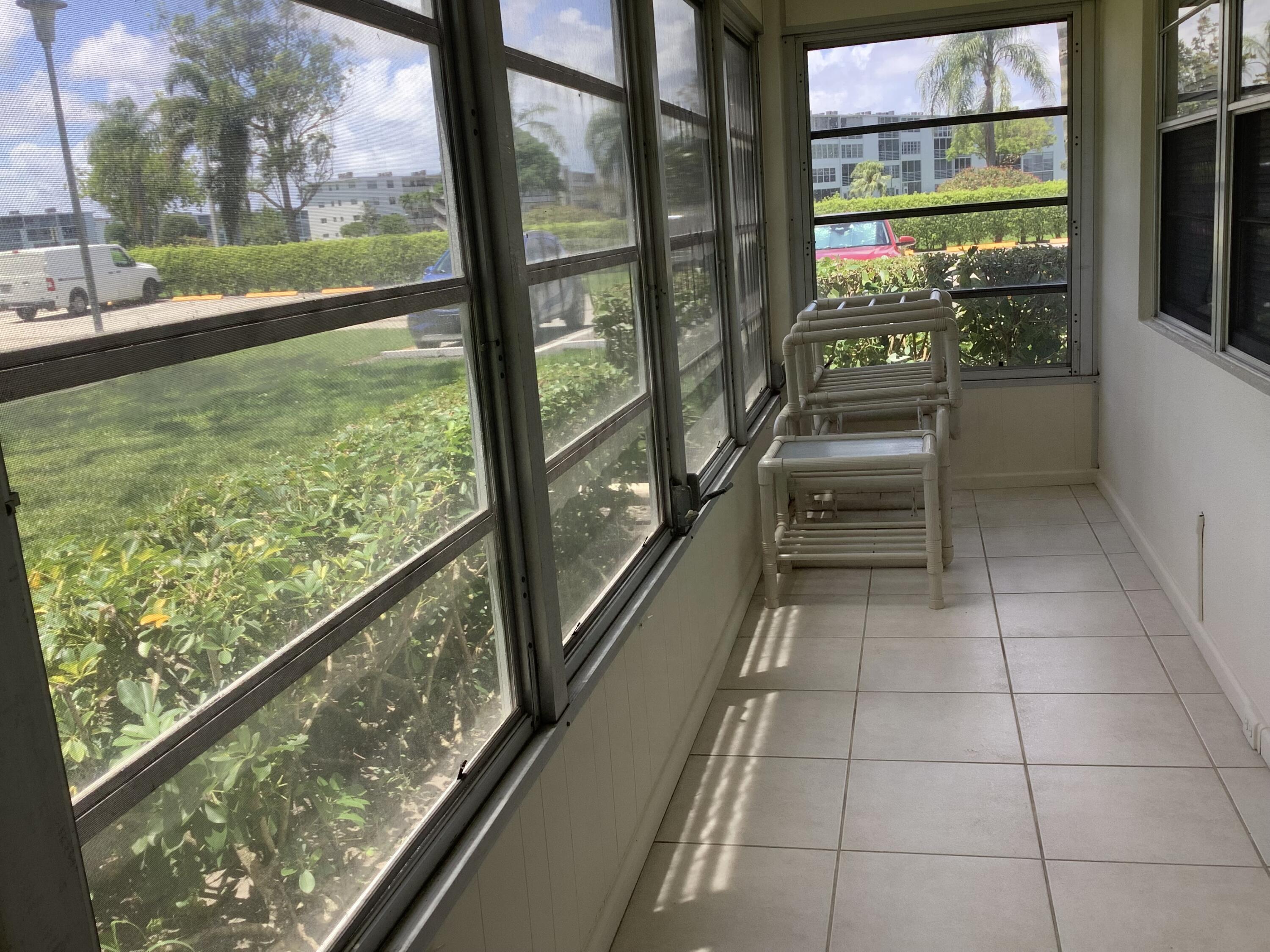 560 Fanshaw North, Unit 560 Boca Raton, FL 33434 - Photo 21 of 26 a view of railway station with a porch