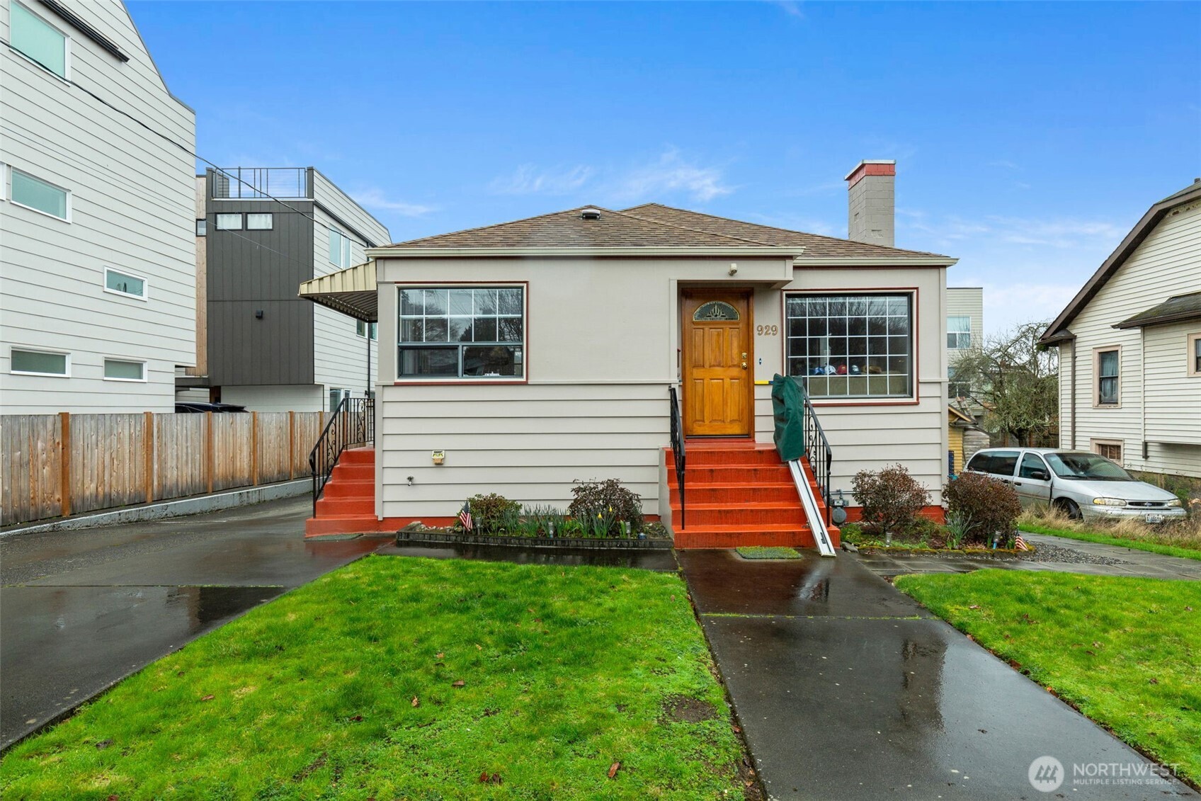 929 Northwest 59th Street Seattle, WA 98107 - Photo 1 of 38 a front view of a house with a yard