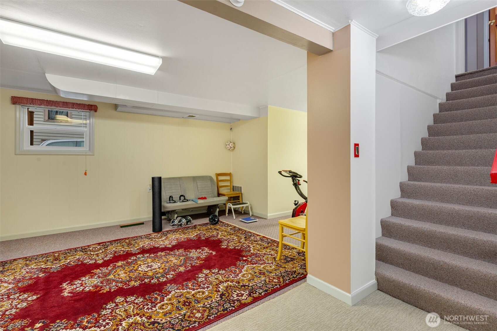 929 Northwest 59th Street Seattle, WA 98107 - Photo 20 of 38 a view of a hallway with wooden floor and a rug