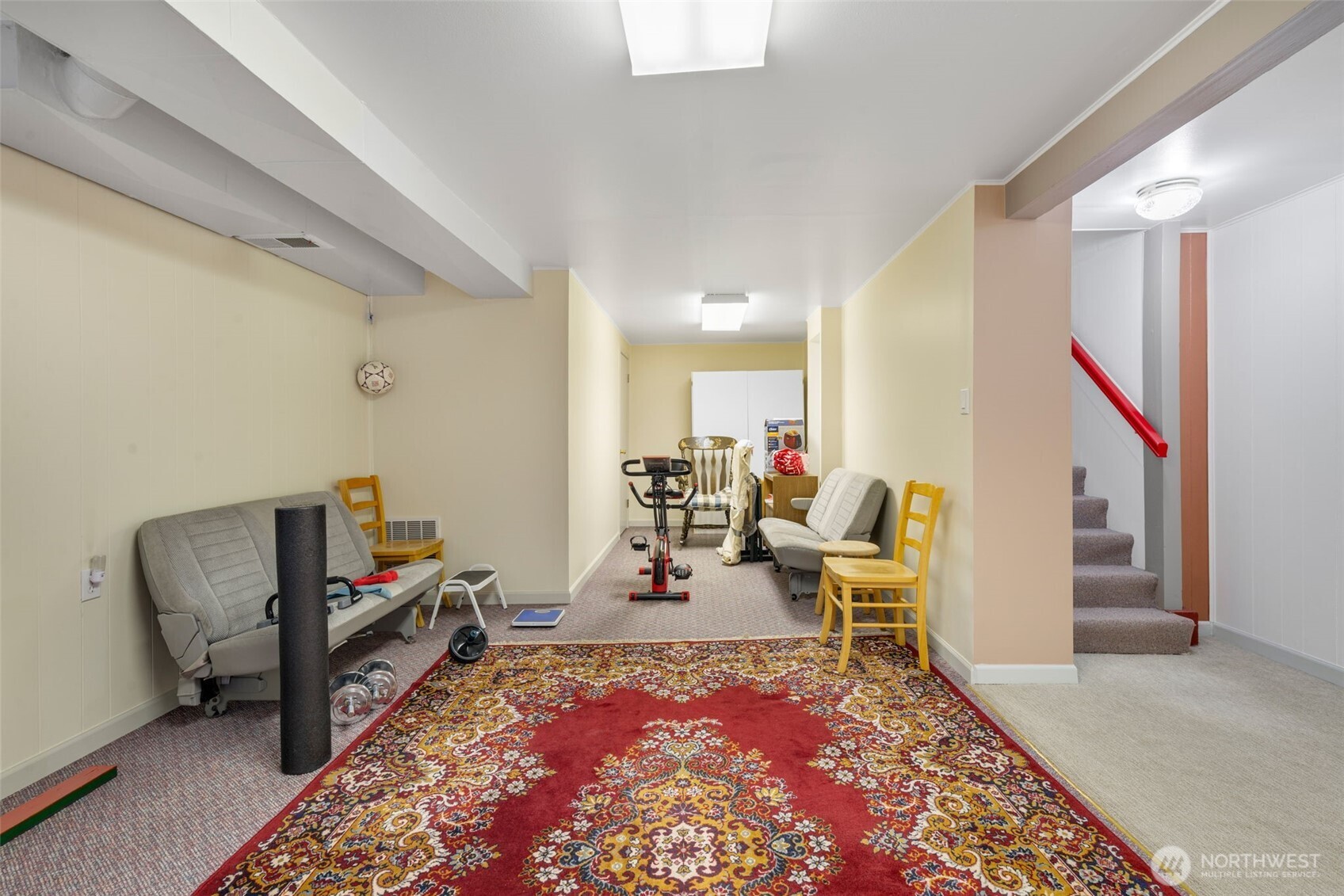 929 Northwest 59th Street Seattle, WA 98107 - Photo 22 of 38 a living room with furniture rug and a table