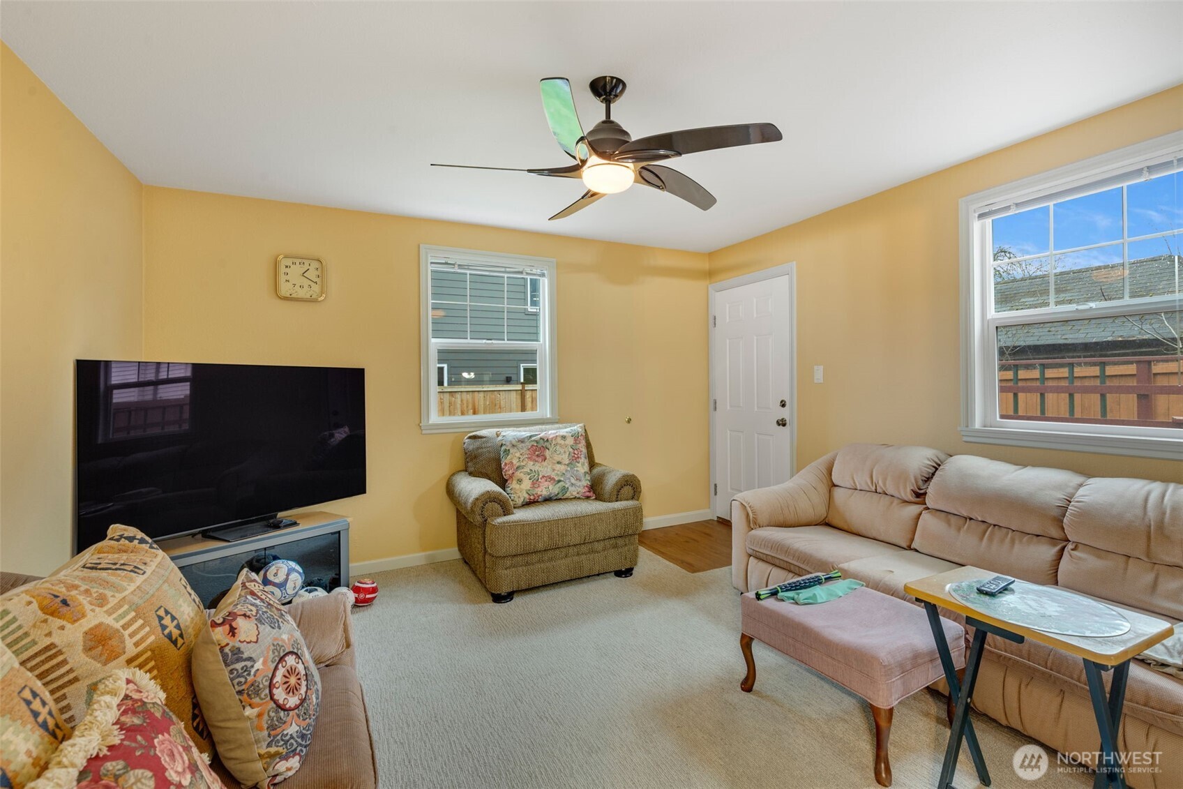 929 Northwest 59th Street Seattle, WA 98107 - Photo 27 of 38 a living room with furniture and a flat screen tv