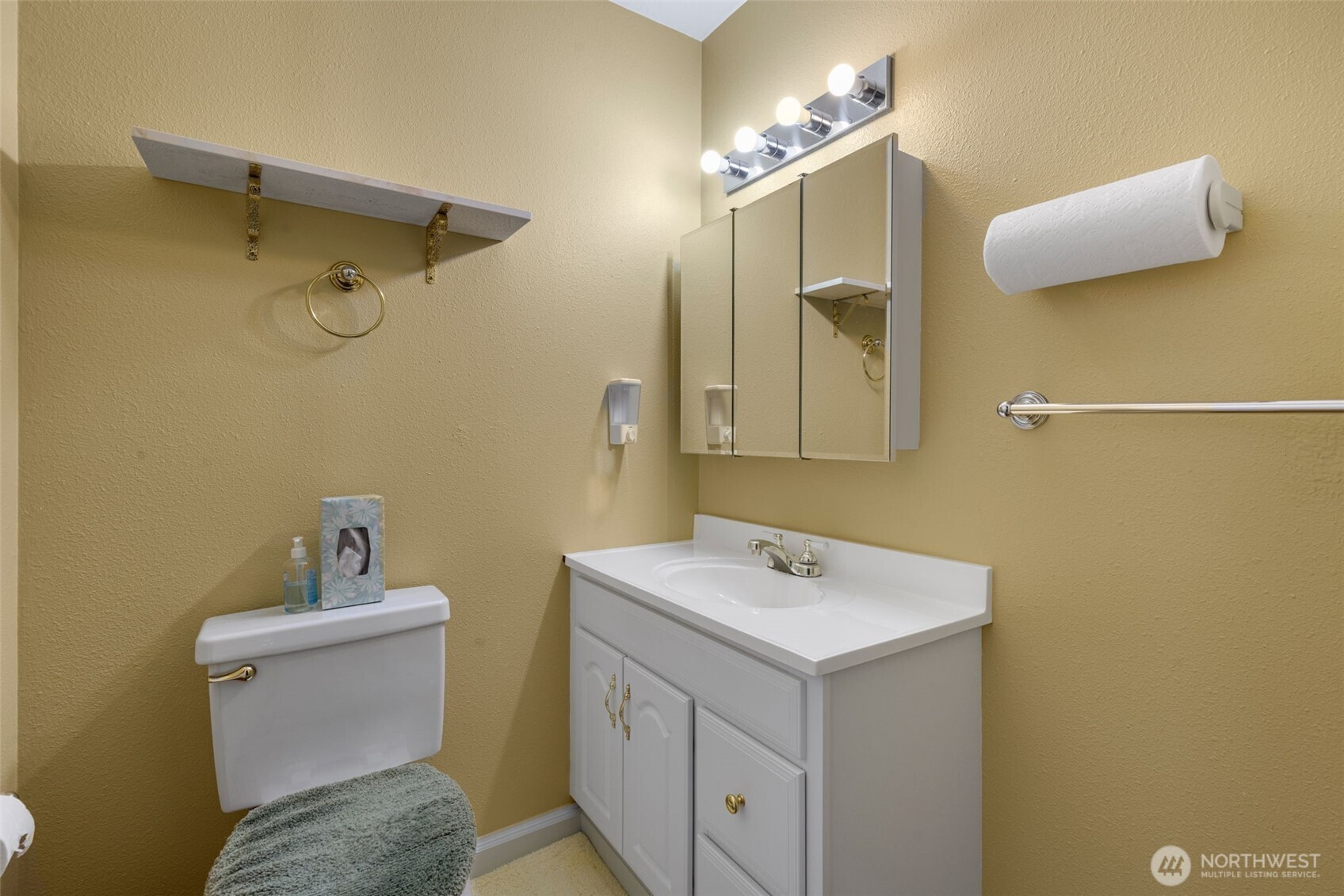 929 Northwest 59th Street Seattle, WA 98107 - Photo 30 of 38 a bathroom with a sink and a mirror
