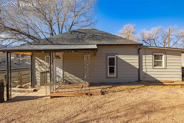 a house with trees in the background