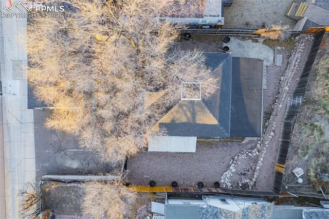 an aerial view of residential houses with outdoor space