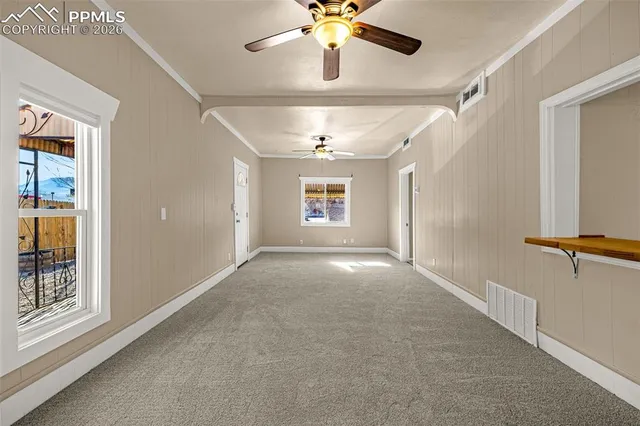 a view of an empty room with a window