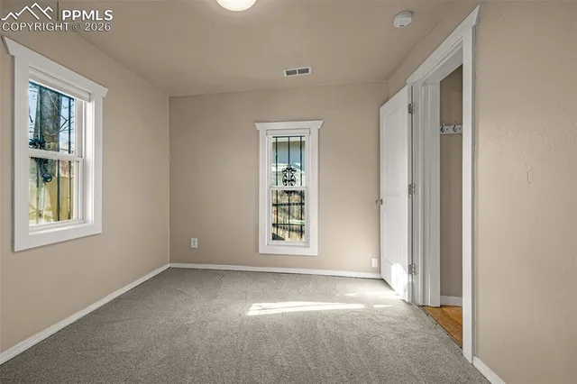 an empty room with windows