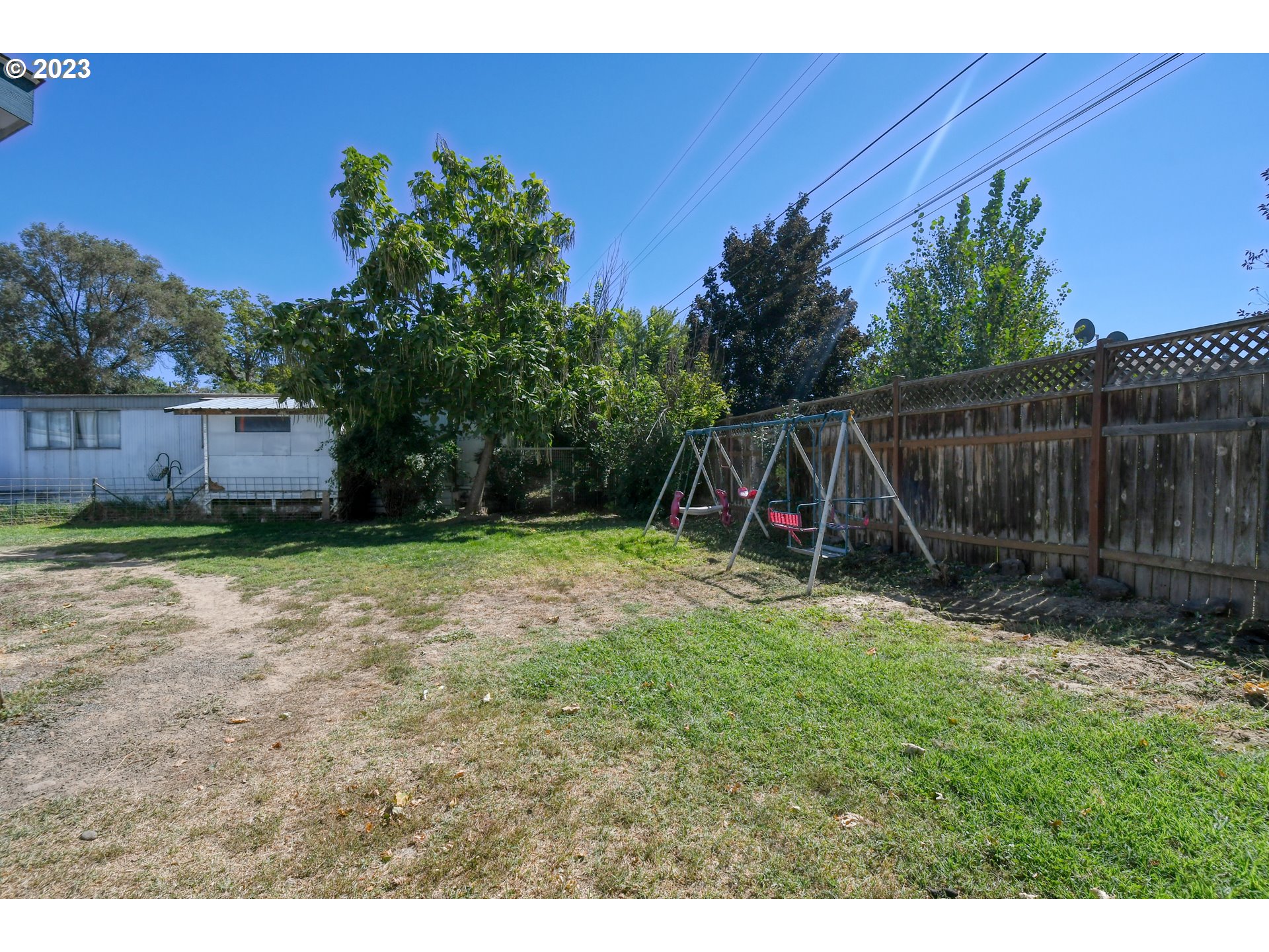 1437 Southwest 37th Street, Unit 14 Pendleton, OR 97801 - Photo 14 of 14 a view of a backyard with a slide