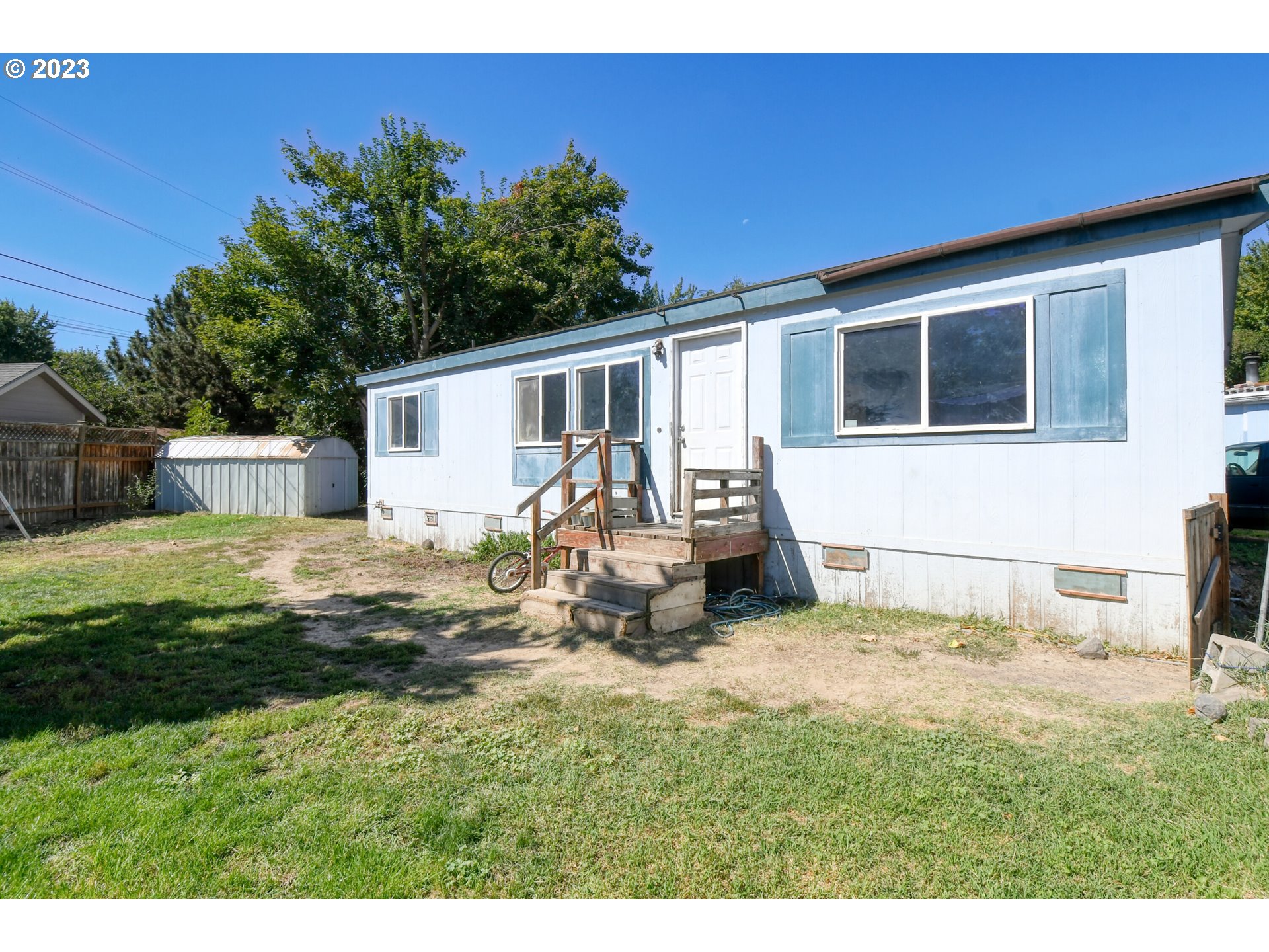 1437 Southwest 37th Street, Unit 14 Pendleton, OR 97801 - Photo 2 of 14 a view of a backyard with a sitting area