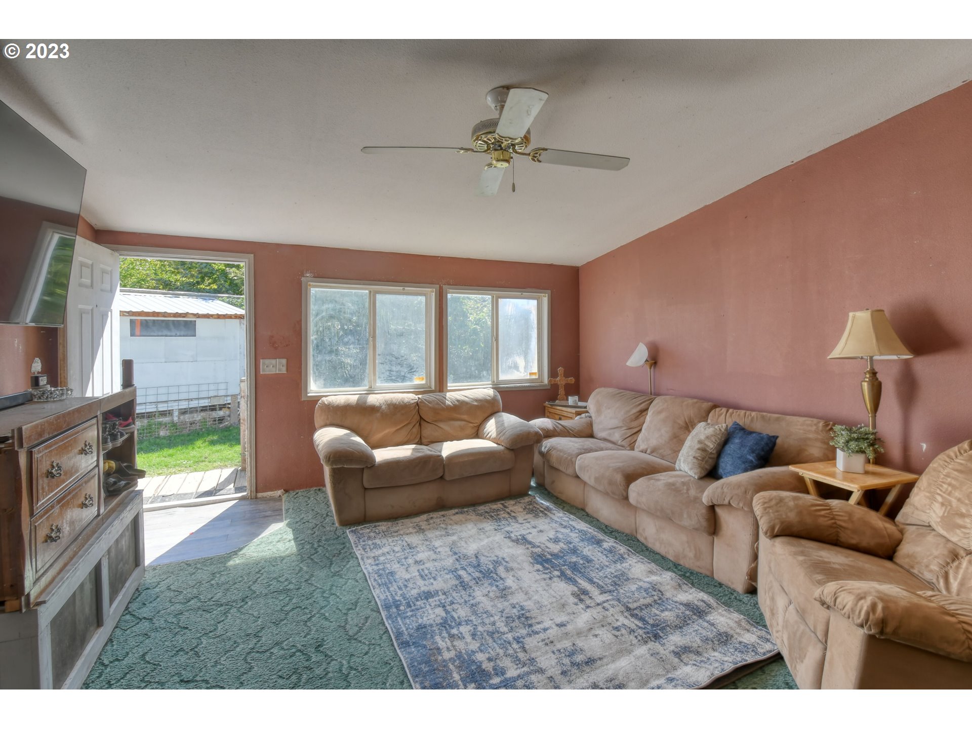 1437 Southwest 37th Street, Unit 14 Pendleton, OR 97801 - Photo 5 of 14 a living room with furniture and a flat screen tv